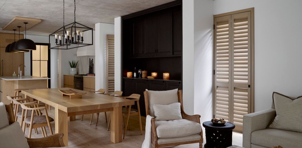 Open-plan living and dining room with custom timber Plantation Shutters