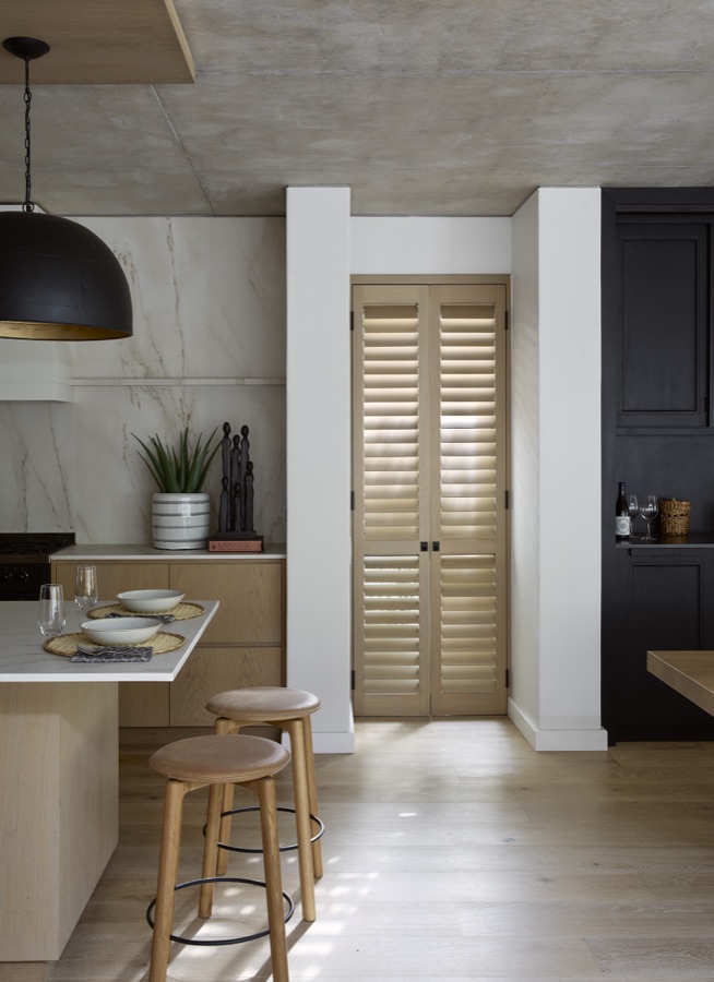 Natural timber shutter doors in a modern kitchen